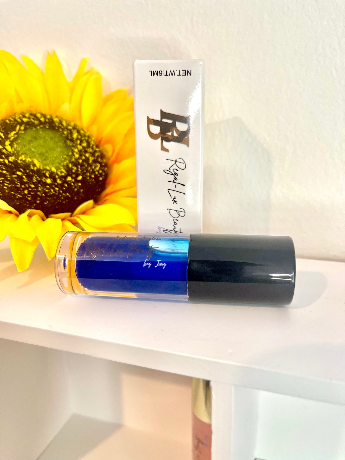 Sapphire color changing lip oil